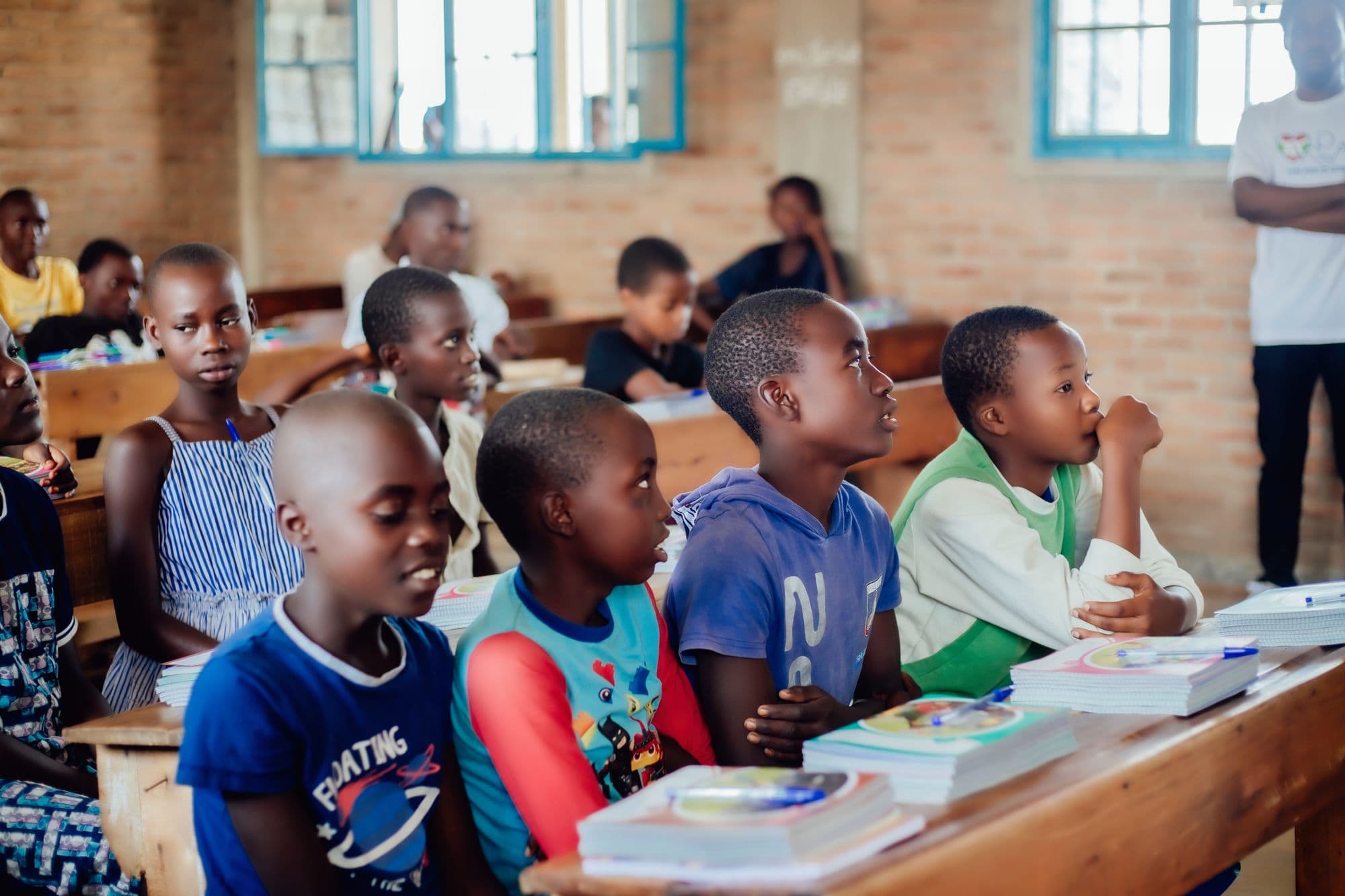 Children sitting at desks in a classroom